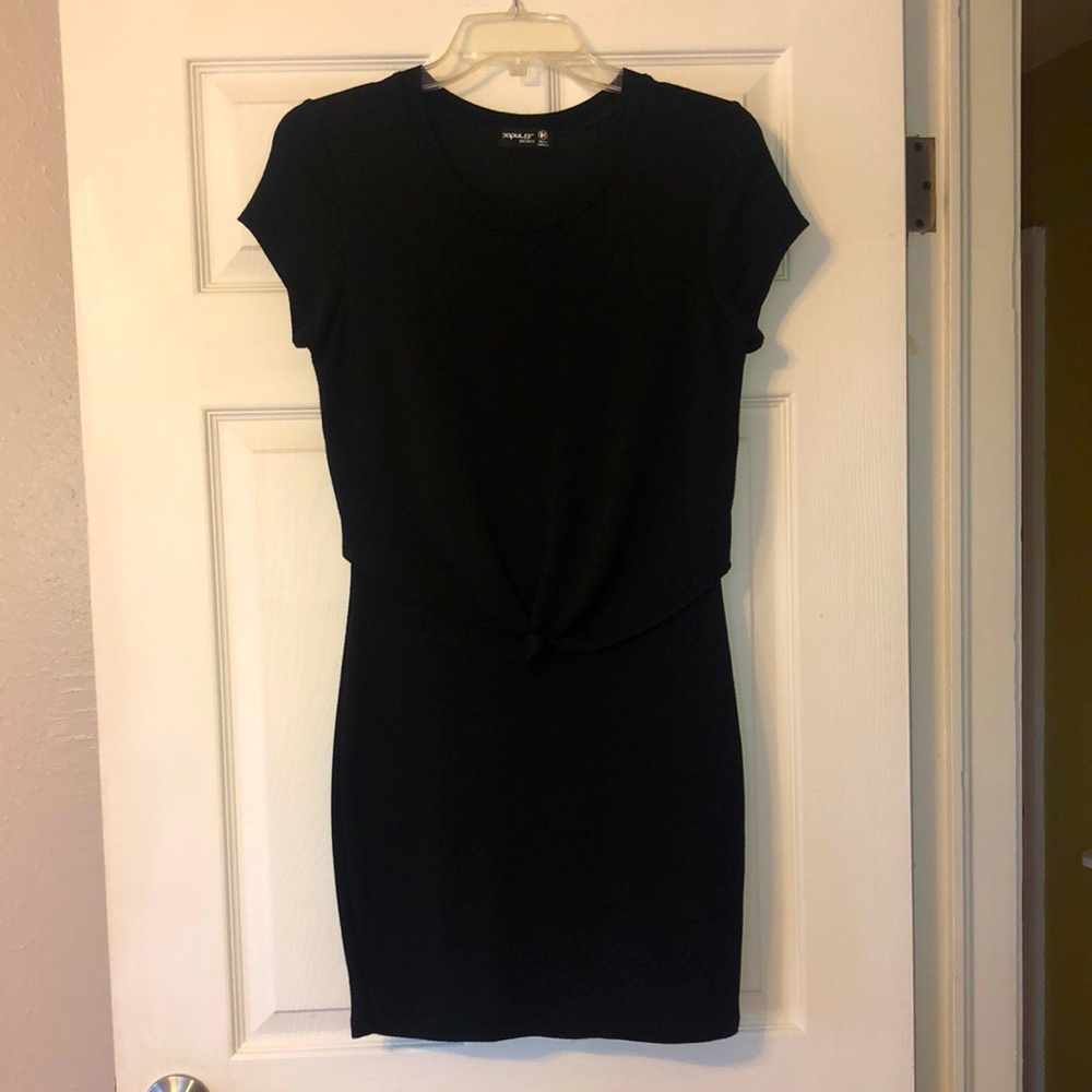 Black form fitted dress with knot overlay